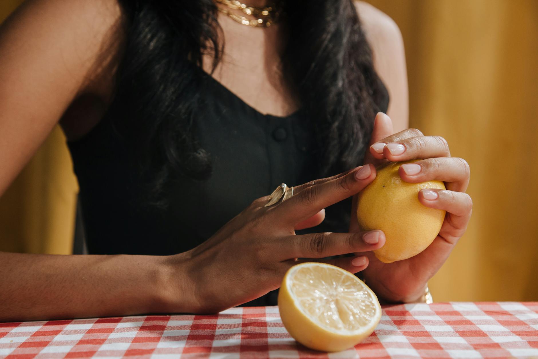 Bright yellow lemons on a soft pastel background, representing fresh connection and renewed intimacy